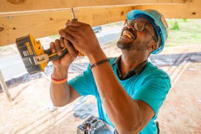 volunteer holding drill